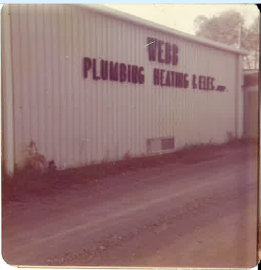 Historic Webb Plumbing, Heating & Electrical company building with the business name painted on its exterior.
